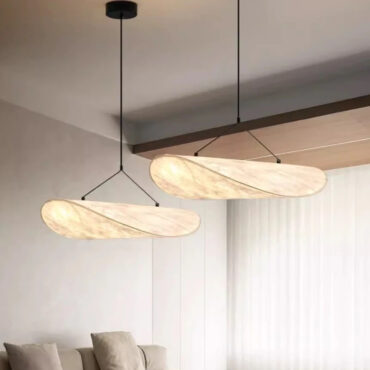 Oslo white silk pendant lights with remote control above a dining table