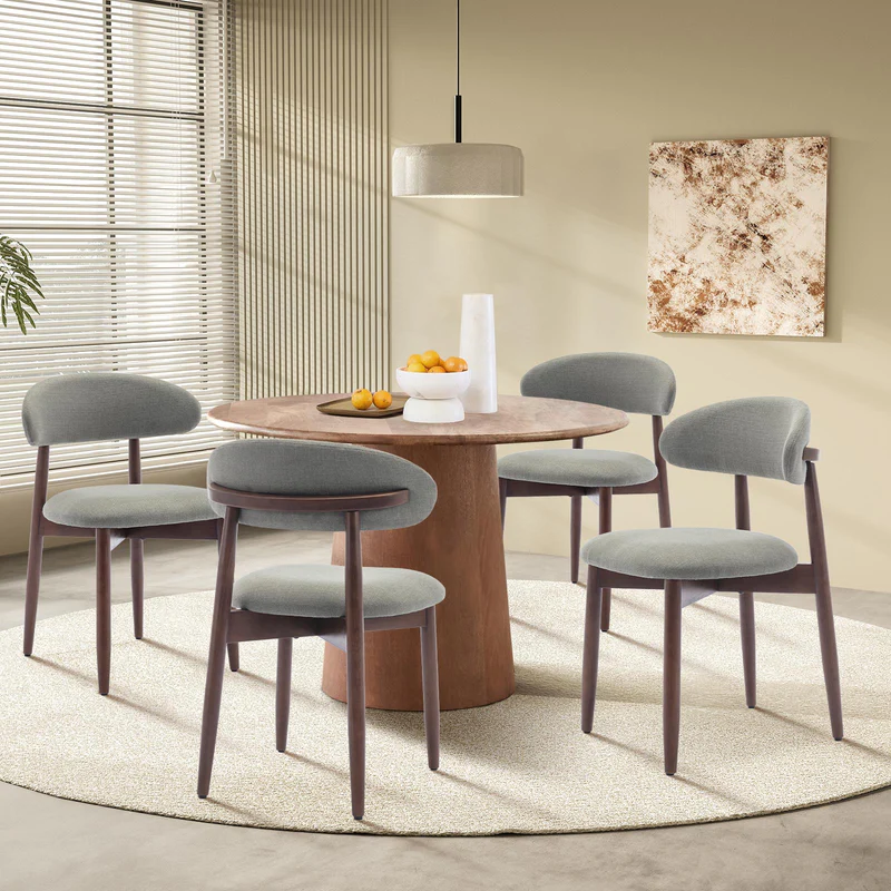 Ringsted green linen dining chairs with solid wood legs at a dining table