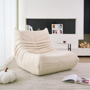 Stavanger ribbed beige Bouclé armchair in a living room