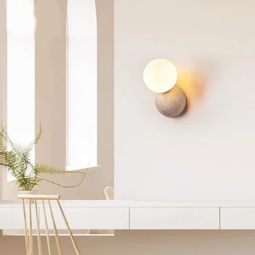 Forma travertine wall sconce with glass shade