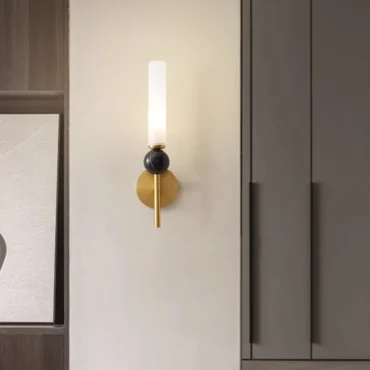 Sigtuna marble and copper wall light in a hallway