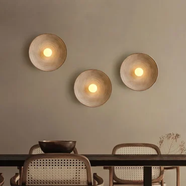 Odda chestnut wall lights in a cluster arrangement above a console table
