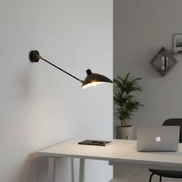 Vega adjustable black aluminium wall light above a desk