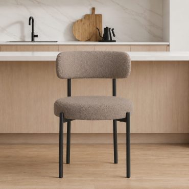 Hanko boucle dining chair with black metal legs in a kitchen