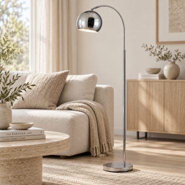 Fagersta chrome arc floor lamp beside a sofa