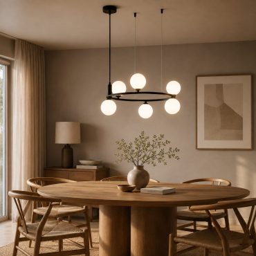 Mysen black glass globe chandelier above a dining table